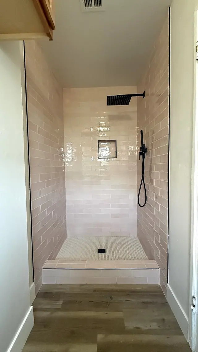 Walk in shower remodel with gray tile by Grain and Stain Renovations in Hendersonville TN