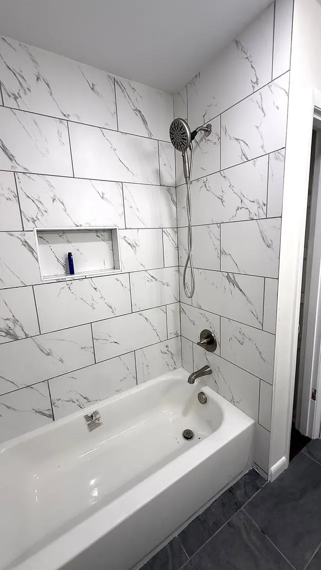 Bathroom remodel with marble tile tub shower by Grain and Stain Renovations in Hendersonville TN