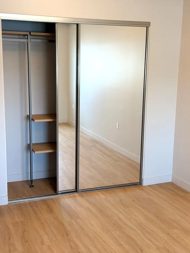 Light wood flooring installation near closet doors by Grain and Stain Renovations in Hendersonville TN