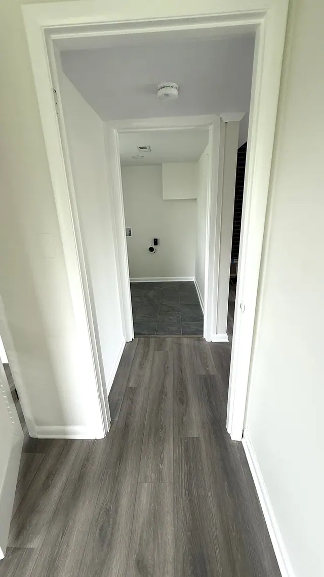 Hallway gray LVP flooring installation by Grain and Stain Renovations in Hendersonville TN