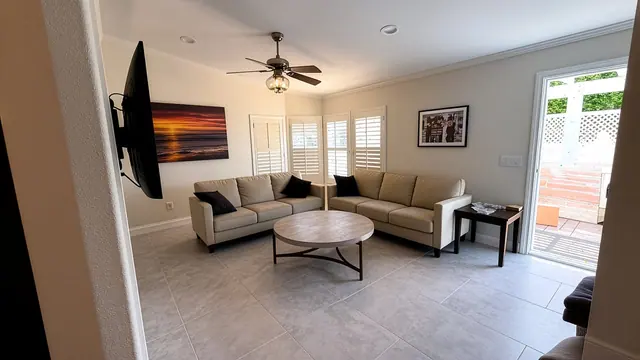 Living room gray tile flooring remodel by Grain and Stain Renovations in Hendersonville TN