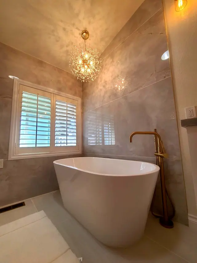 Luxury bathroom remodel with freestanding tub and chandelier by Grain and Stain Renovations in Hendersonville TN