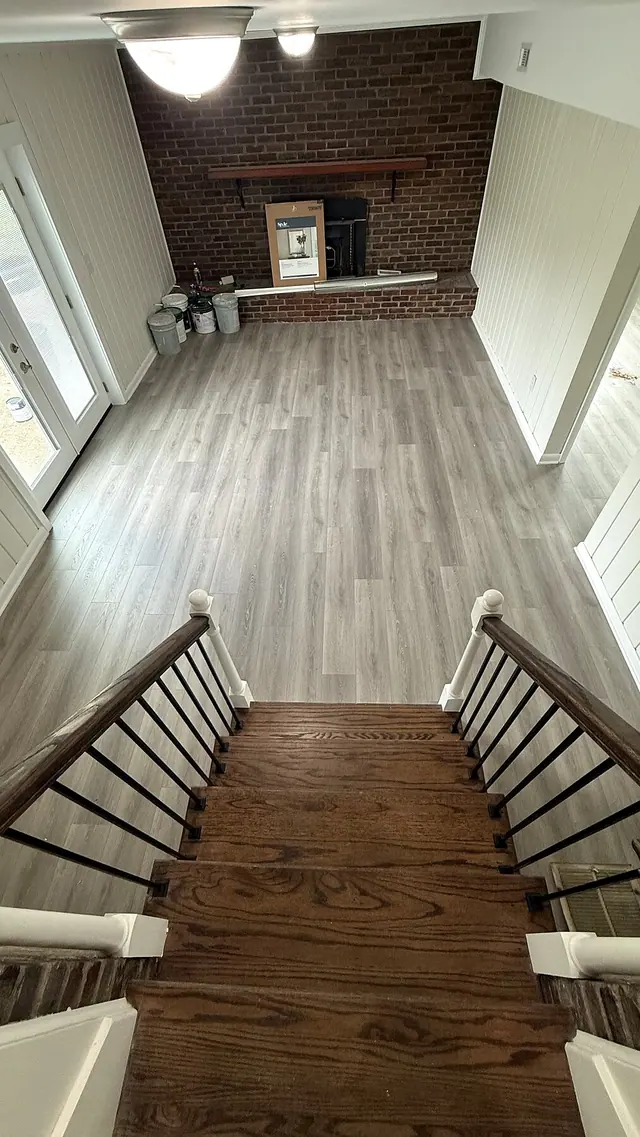 Whole home renovation with finished stairway, flooring, wall paneling, trim, and interior updates by Grain and Stain Renovations in Hendersonville TN